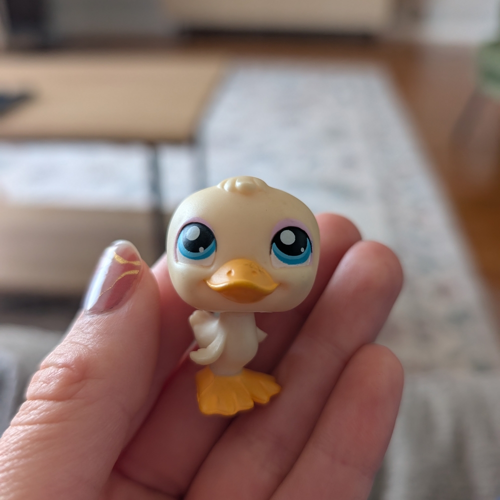 Cute Duck Figurine with Blue Eyes